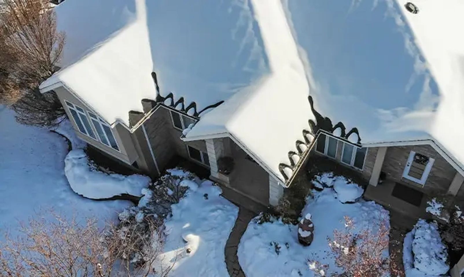 HeatBots Auto-Melt managing roof heat cable