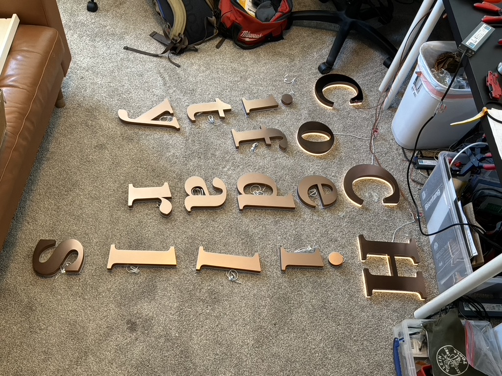 Channel letters laid out for assembly